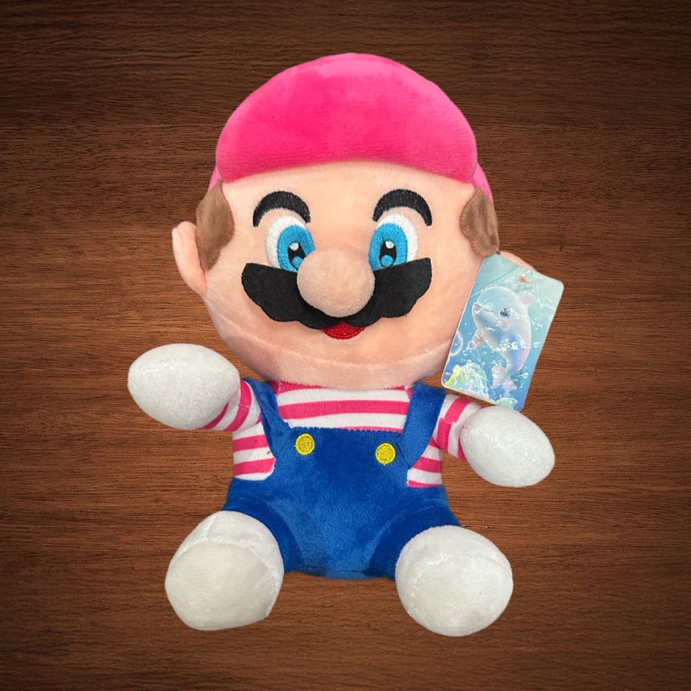 Mario bros in Blue overllas and pink hat. Stuffed toy. Attachable suction cup